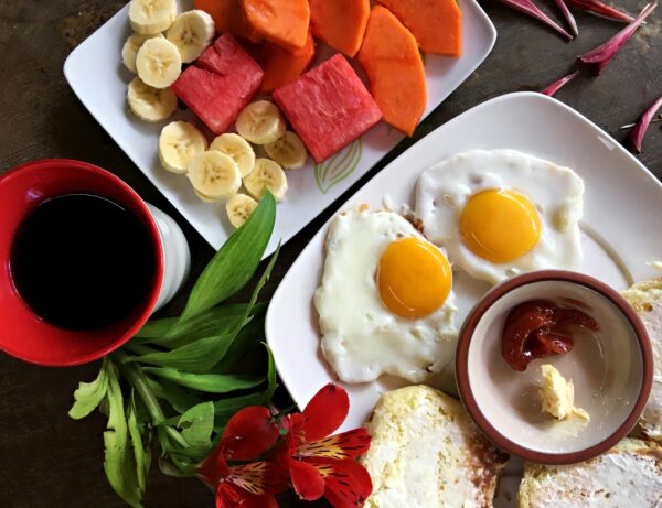 Delicious Garden Breakfast with Eggs, Toasts and Fruit