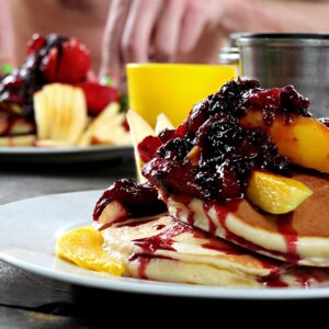 Delicious Garden Breakfast with Pancakes and Fruits