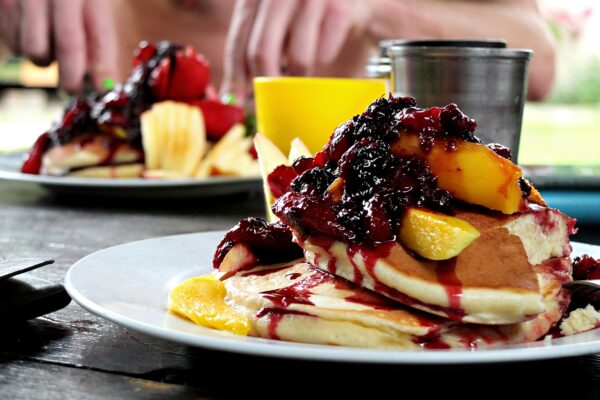 Delicious Garden Breakfast with Pancakes and Fruits